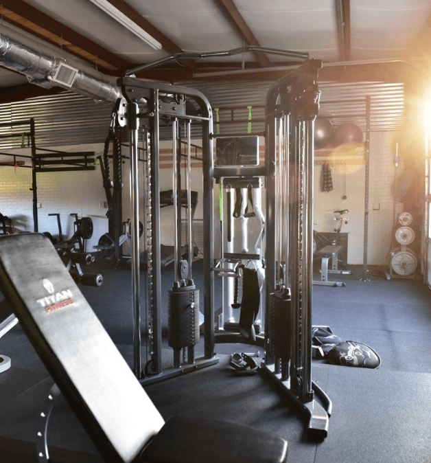 Tiger ATX Training private gym in Southwest Austin showing cable machines, free weights, and dedicated space for appointment-only one-on-one coaching